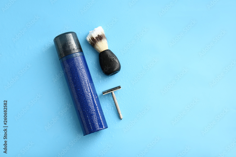 Set of male shaving accessories on color background