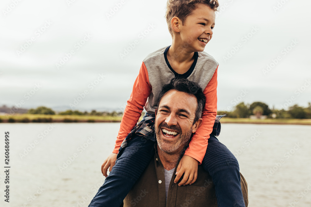 Father and son on a day out near a lake