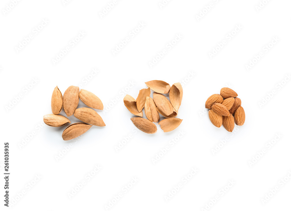 Tasty almonds on white background