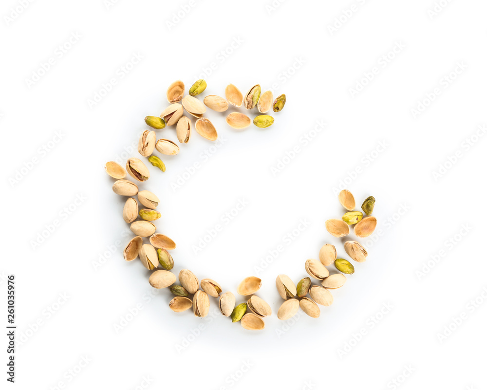 Tasty pistachio nuts on white background