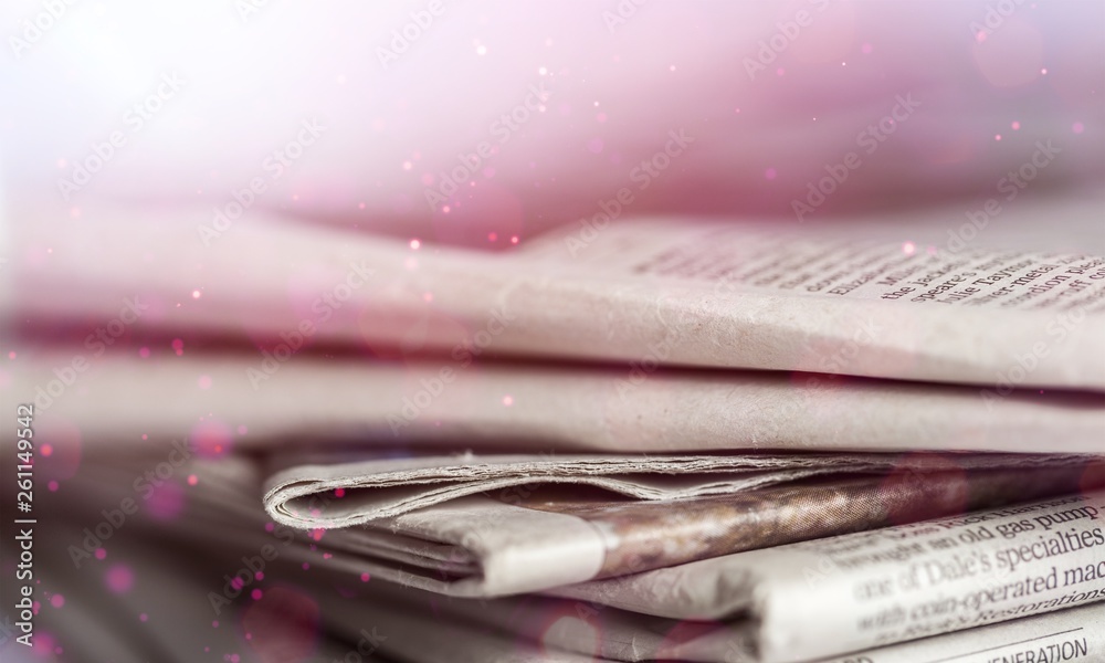 Pile of newspapers on  background close up