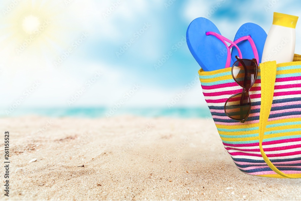 , bag, sunglasses  on a tropical beach