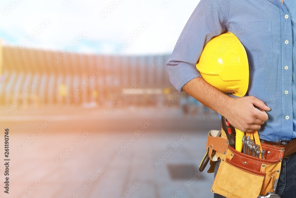 Worker with a tool belt. Isolated over white background.