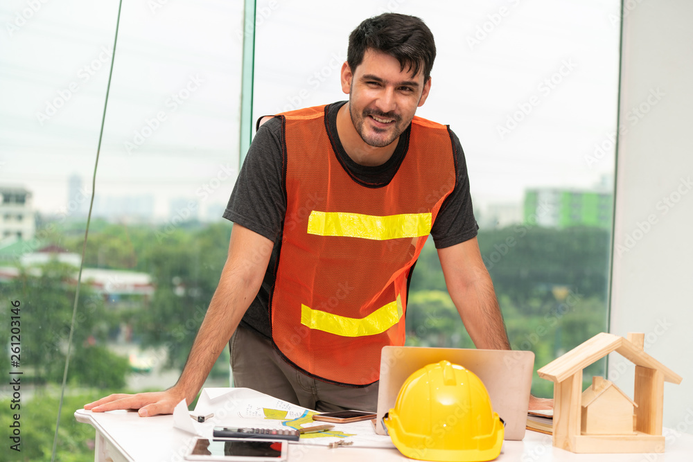 Construction engineer worker working in office. Real estate building contractor business concept.