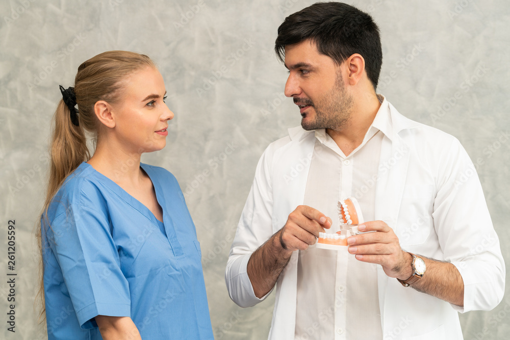 Dentist and nurse assistant working in dental office at the hospital. Dentistry concept.