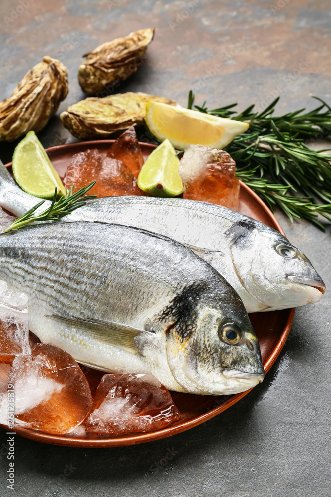 Fresh fish on grey table