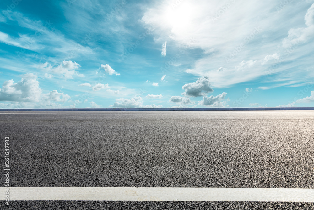 Empty asphalt road ground and blue sky with white clouds scene