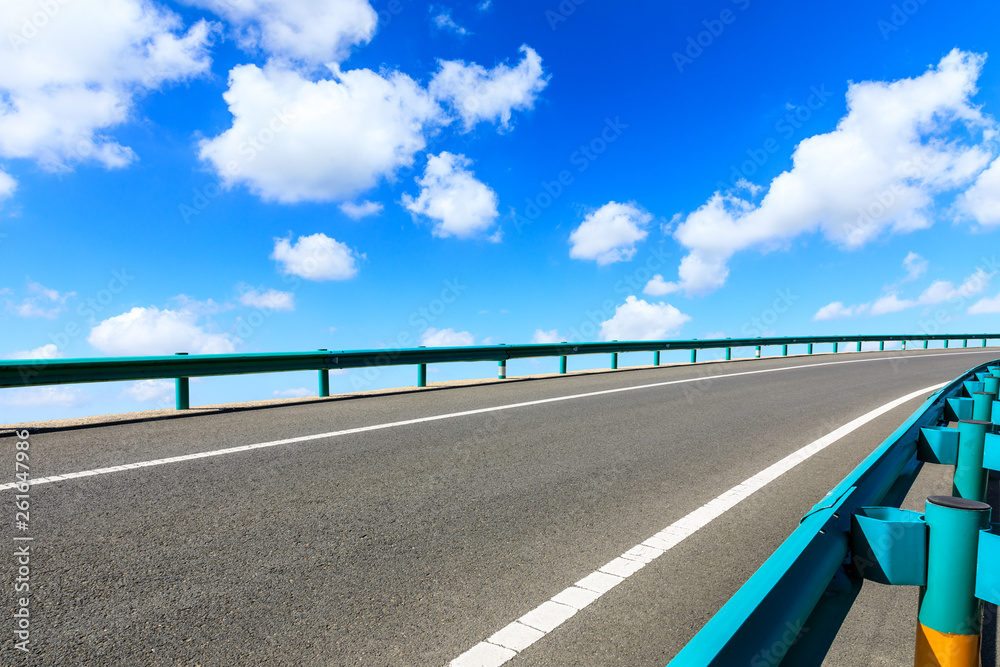 Empty asphalt road ground and blue sky with white clouds scene