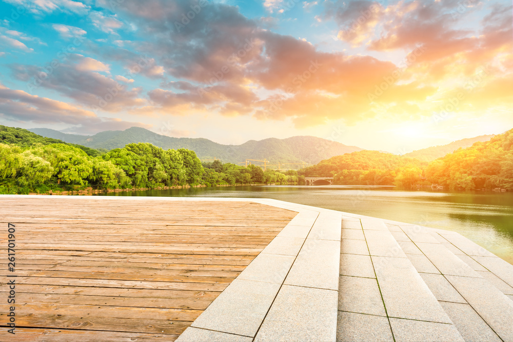 Wooden floor platform and lake with green mountains background in Hangzhou