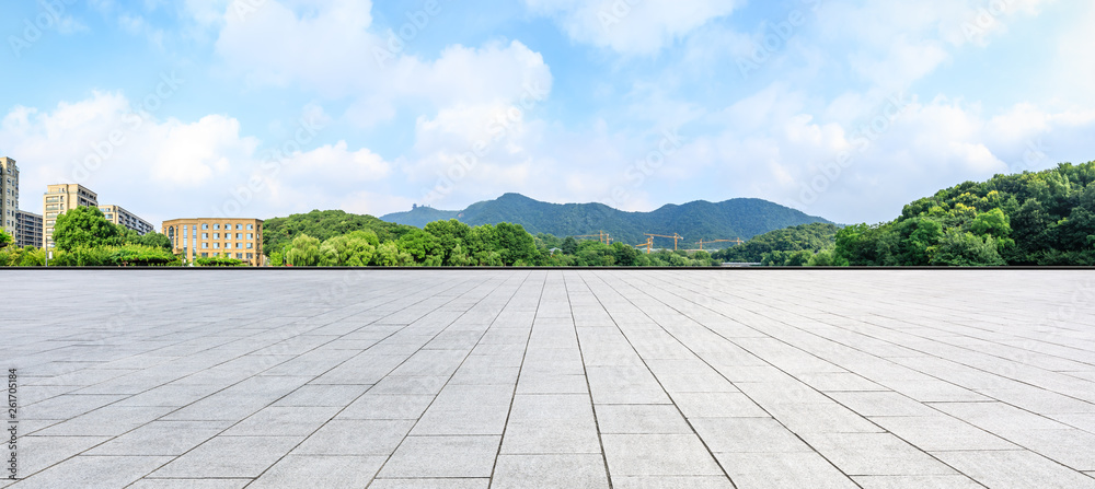 Empty square floor and green mountain with sky landscape