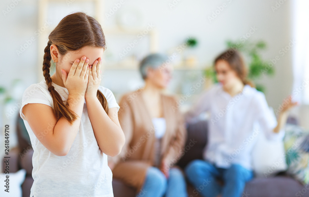 conflict of family three generations angry mother and grandmother scolding  naughty child.