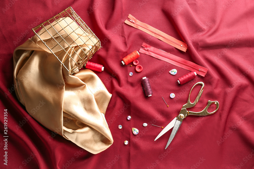 Tailors accessories on fabric background