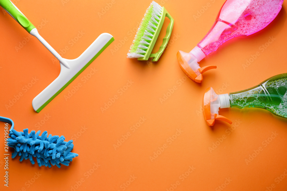 Set of cleaning supplies on color background