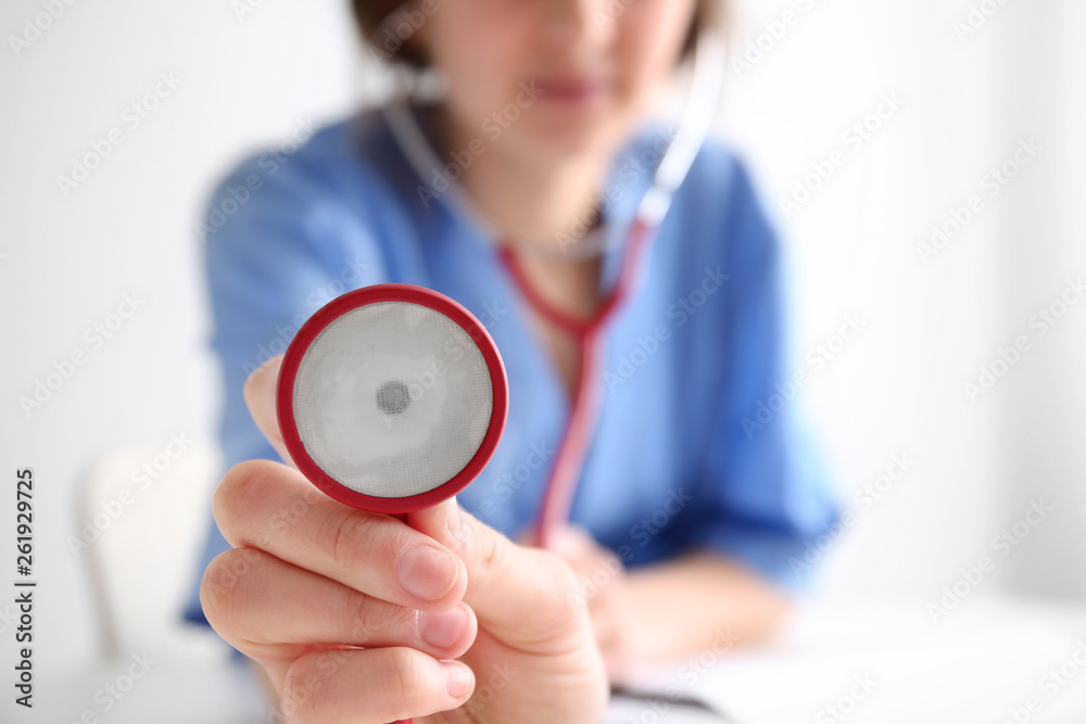 Female doctor with stethoscope, closeup