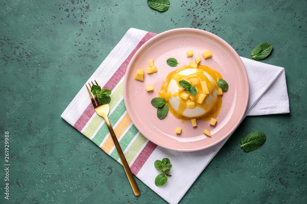 Plate with tasty panna cotta on color background