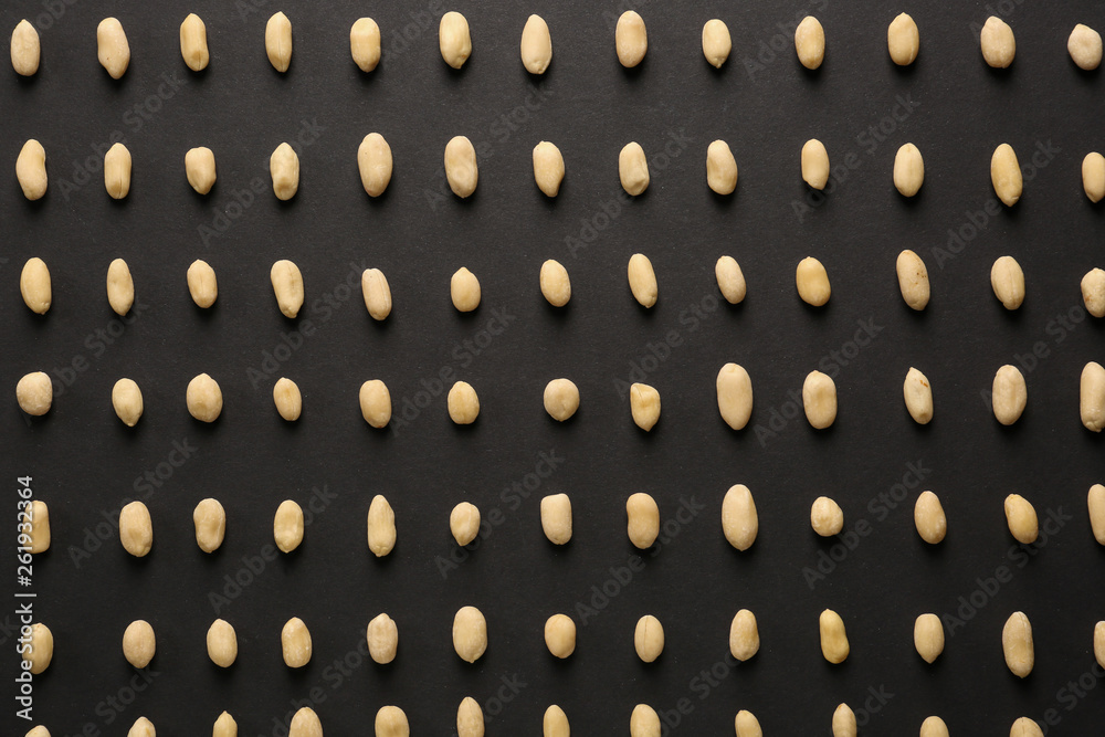 Tasty peanuts on dark background