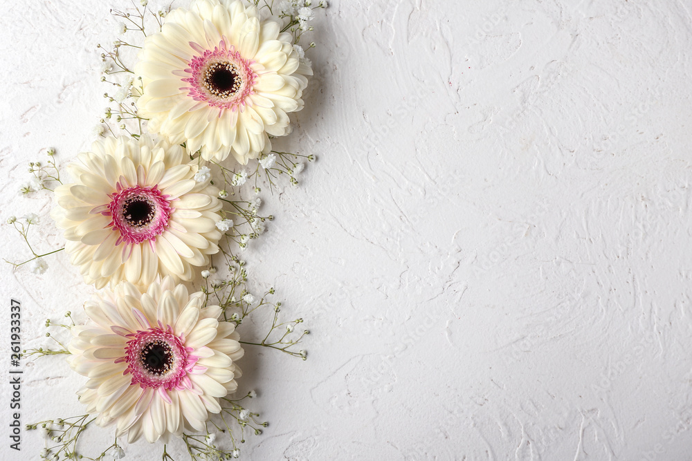 Beautiful flowers on white textured background