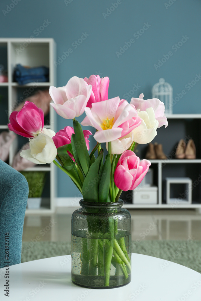 Bouquet of beautiful tulips on table in room