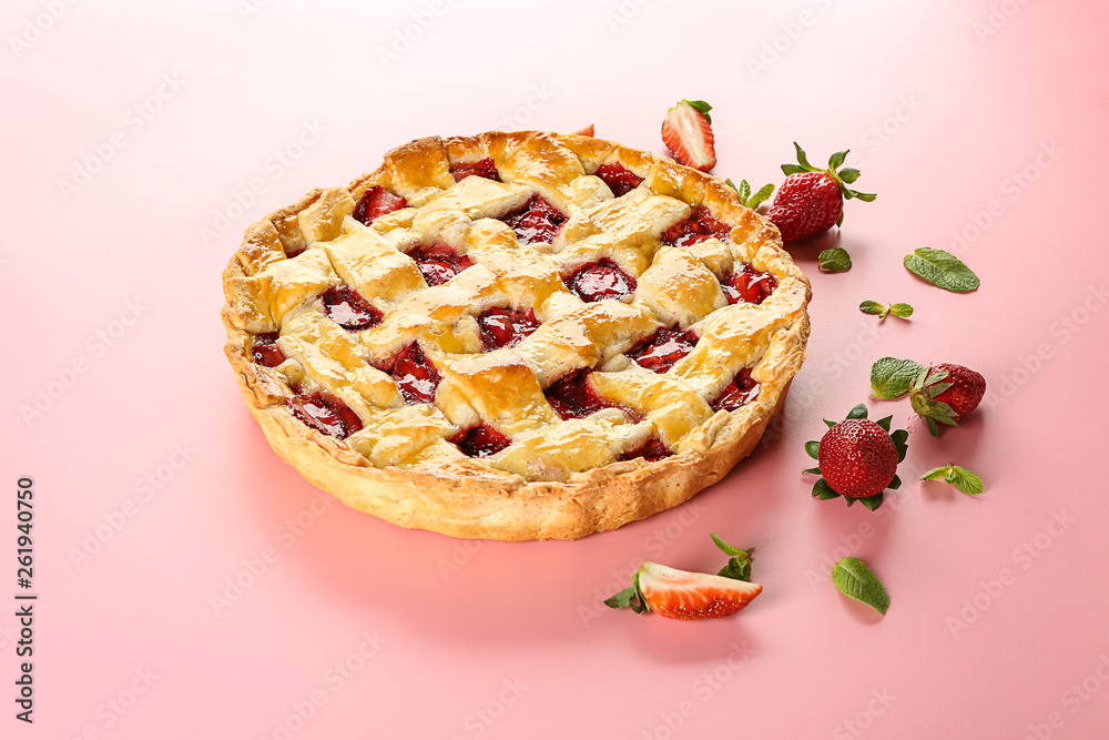 Tasty strawberry pie on color background