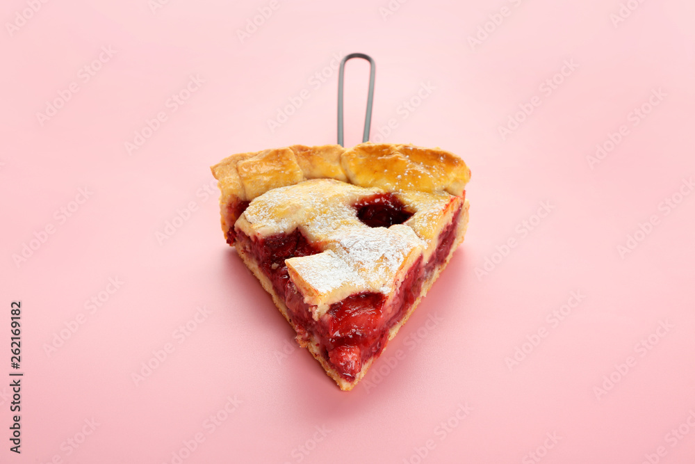 Piece of tasty strawberry pie on color background