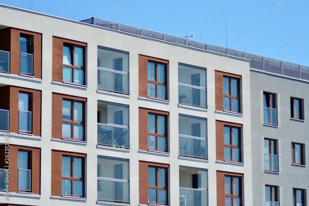 Modern apartment buildings on a sunny day with a blue sky. Facade of a modern apartment building