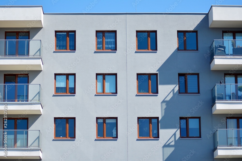 Modern apartment buildings on a sunny day with a blue sky. Facade of a modern apartment building