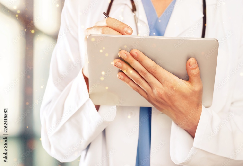 Close-up Doctor at hospital working with tablet pc