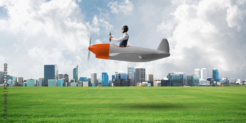 Businessman in aviator hat and goggles