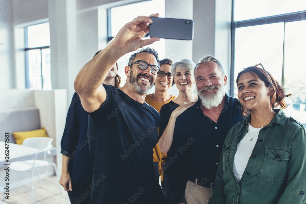 Business team taking selfie