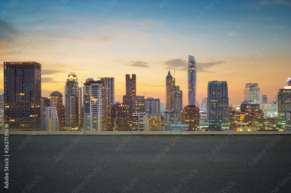 Cityscape sunset view of Bangkok modern office business building and high skyscraper in business dis