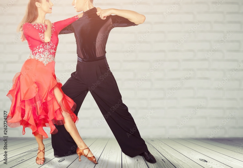 Man and a woman dancing Salsa on background