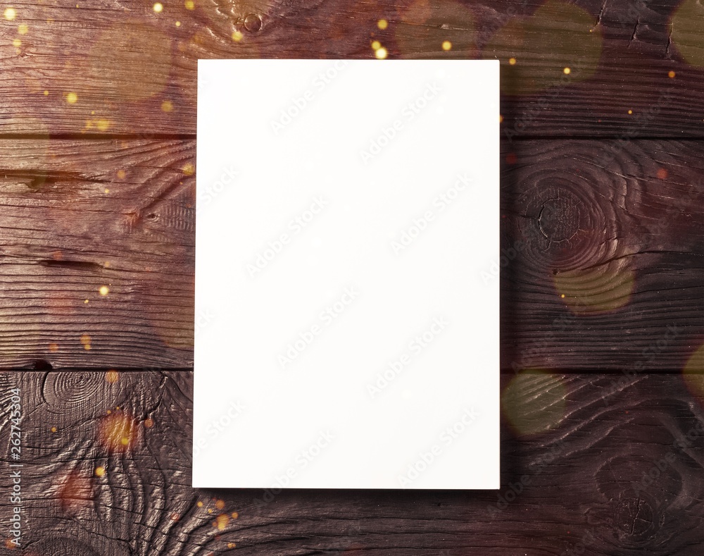 Blank book cover on black wooden  background