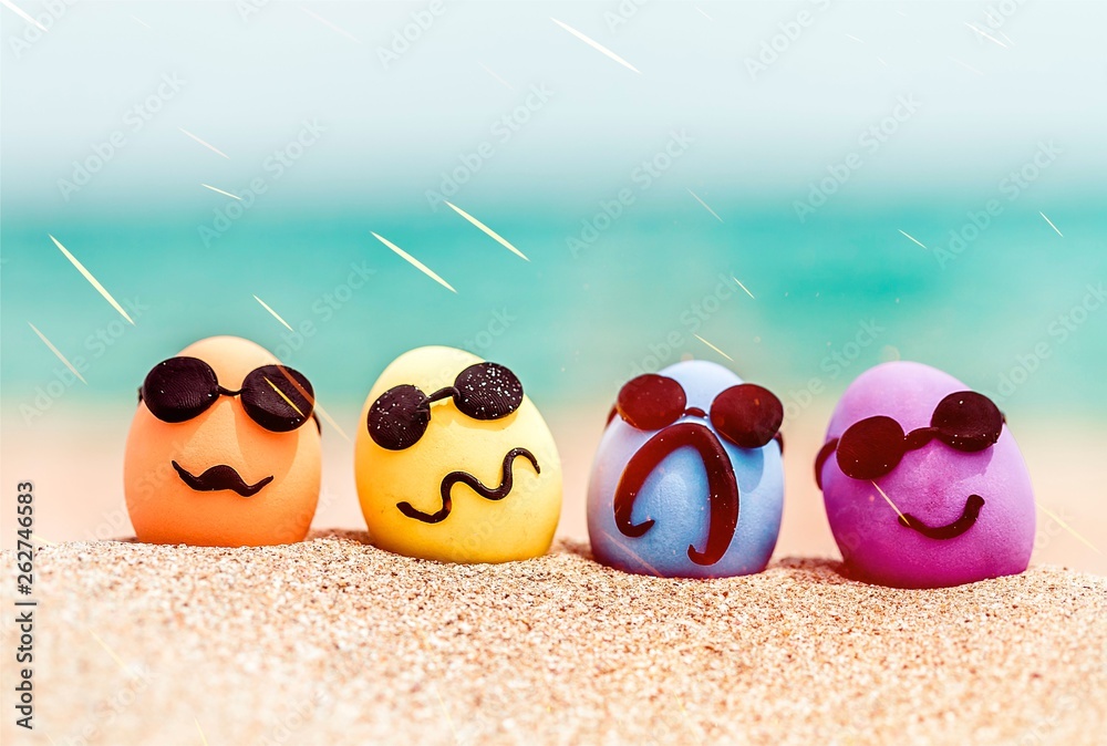 Funny eggs with sunglasses on exotic beach background