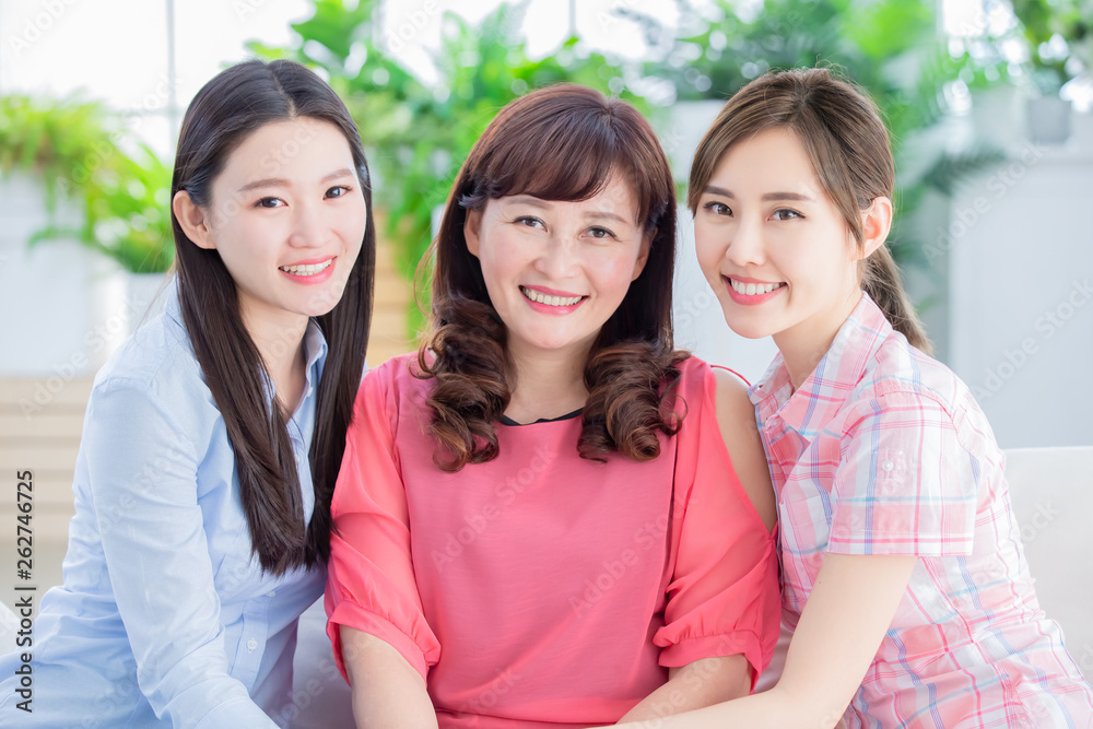 two daughter with mother smile