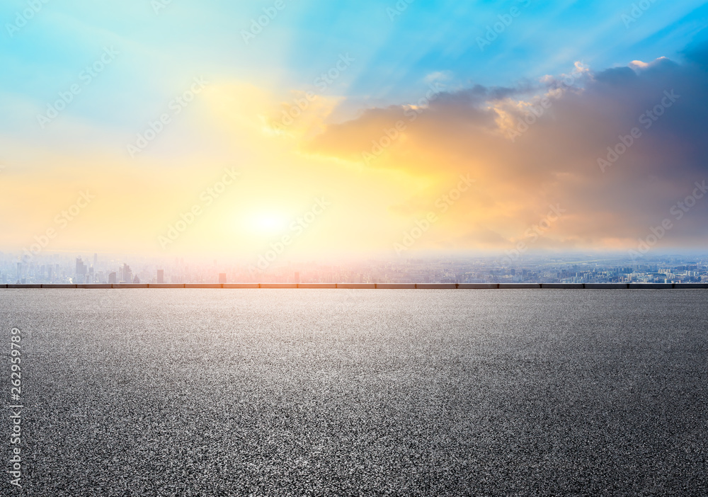 Shanghai city skyline and empty asphalt road ground scenery at sunrise