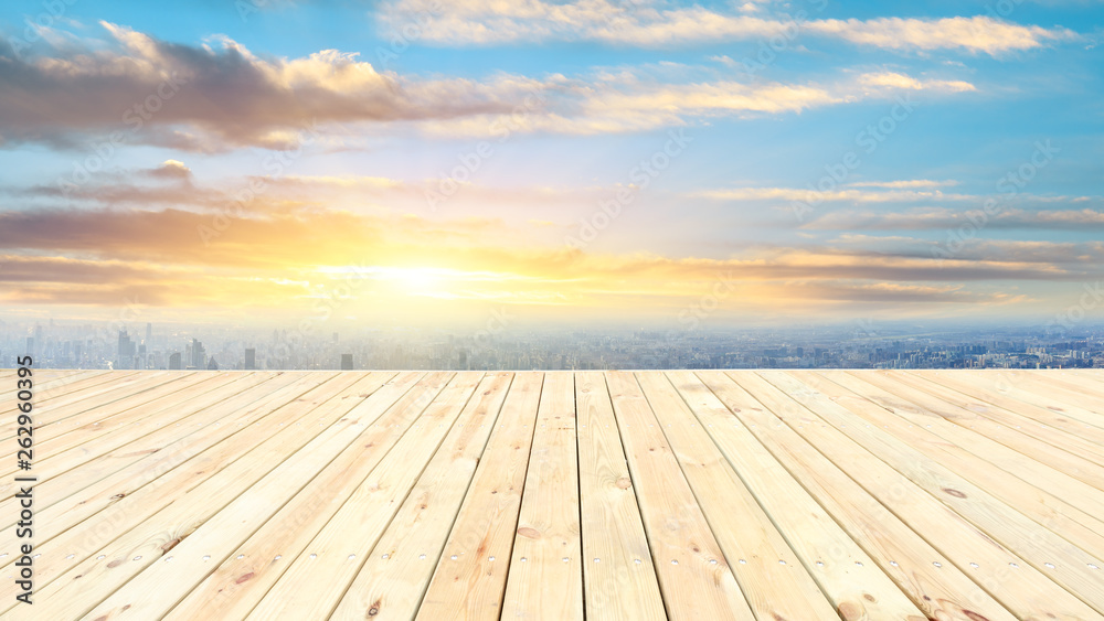 Shanghai city skyline and wooden platform with beautiful clouds scenery at sunset