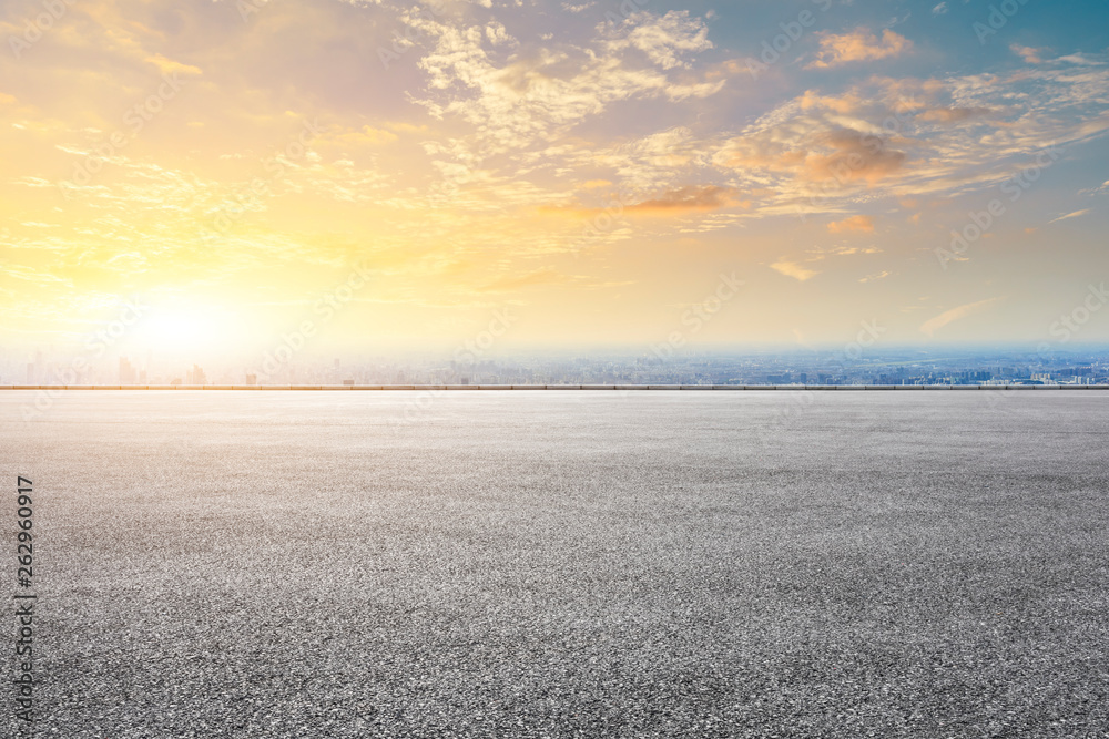 Shanghai city skyline and asphalt race track ground scenery at sunrise