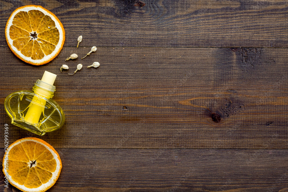 citrus fragrance diffuser for air freshness on wooden background top view mock-up