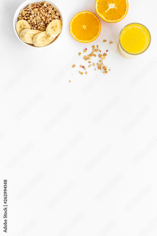 food for healthy breakfast with granola and fresh orange juice on bright white background top view m