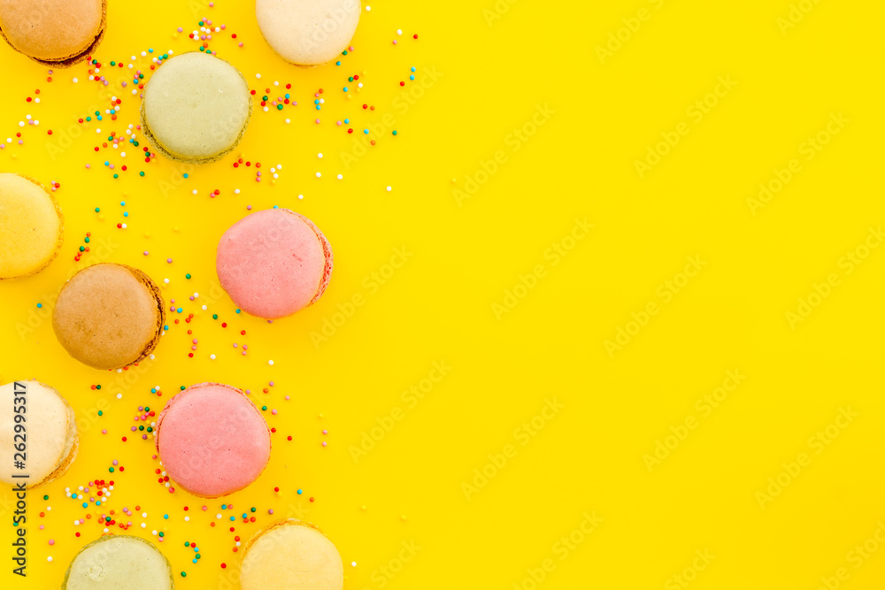 sweet dessert pattern with macarons on yellow background flat lay mockup