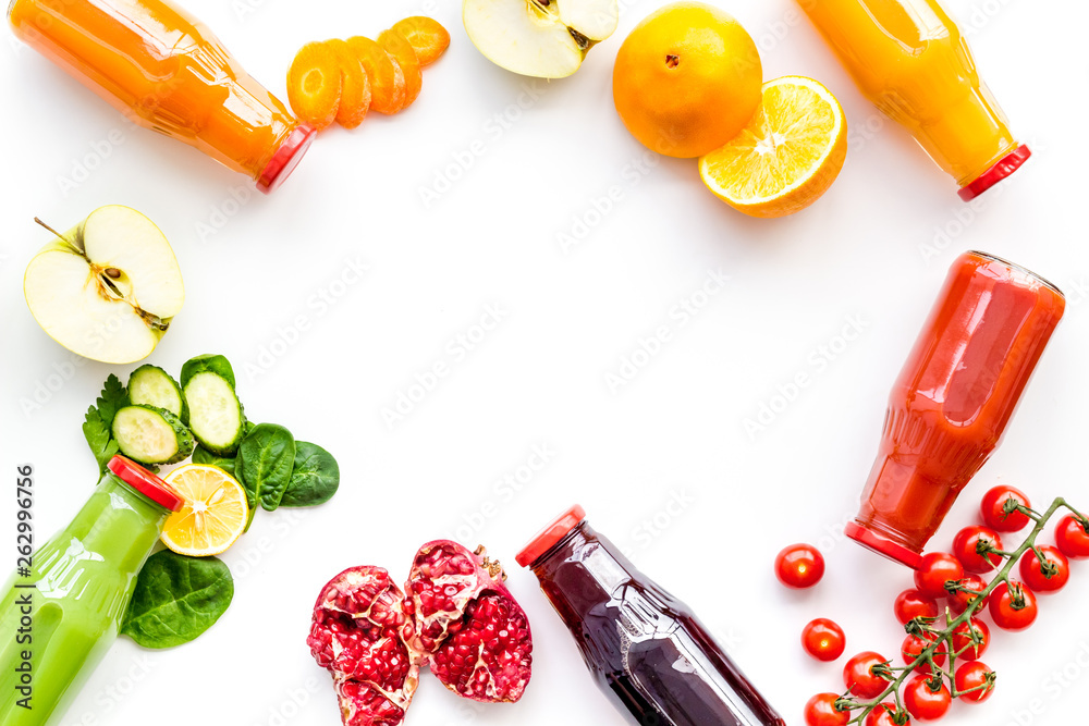 bottles with fresh carrot, tomato, apple, cucumber, lemon, pomegranate juices on white background to