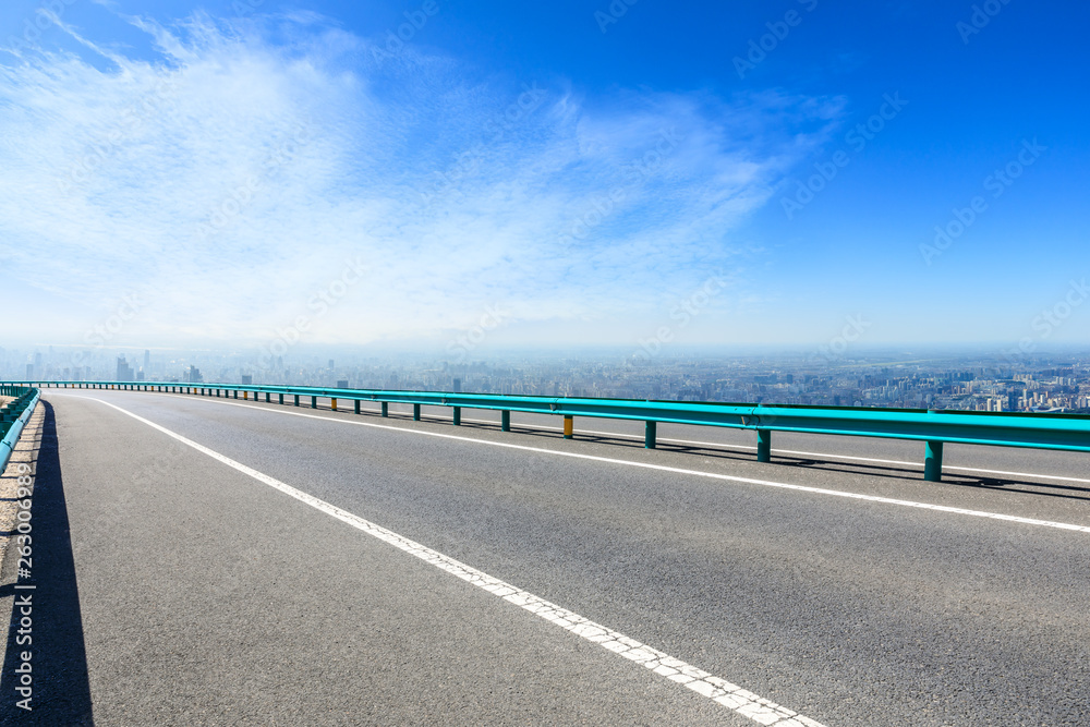 Shanghai city skyline and empty asphalt road scenery,China