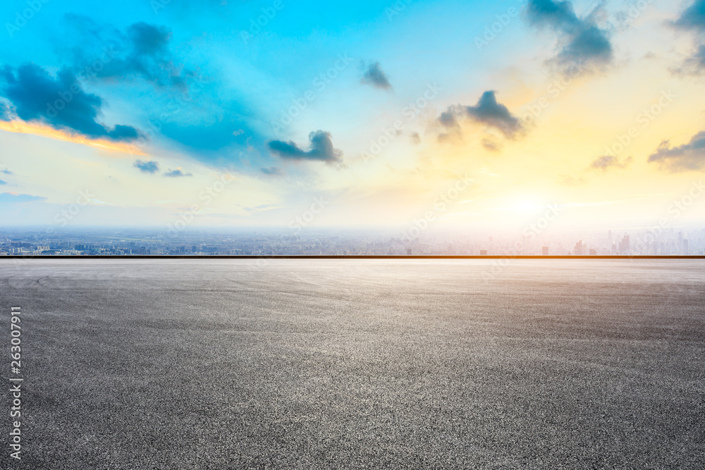 Shanghai city skyline and asphalt race track ground at sunrise,high angle view