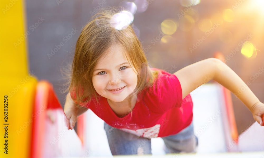 Happy Active little girl on playground