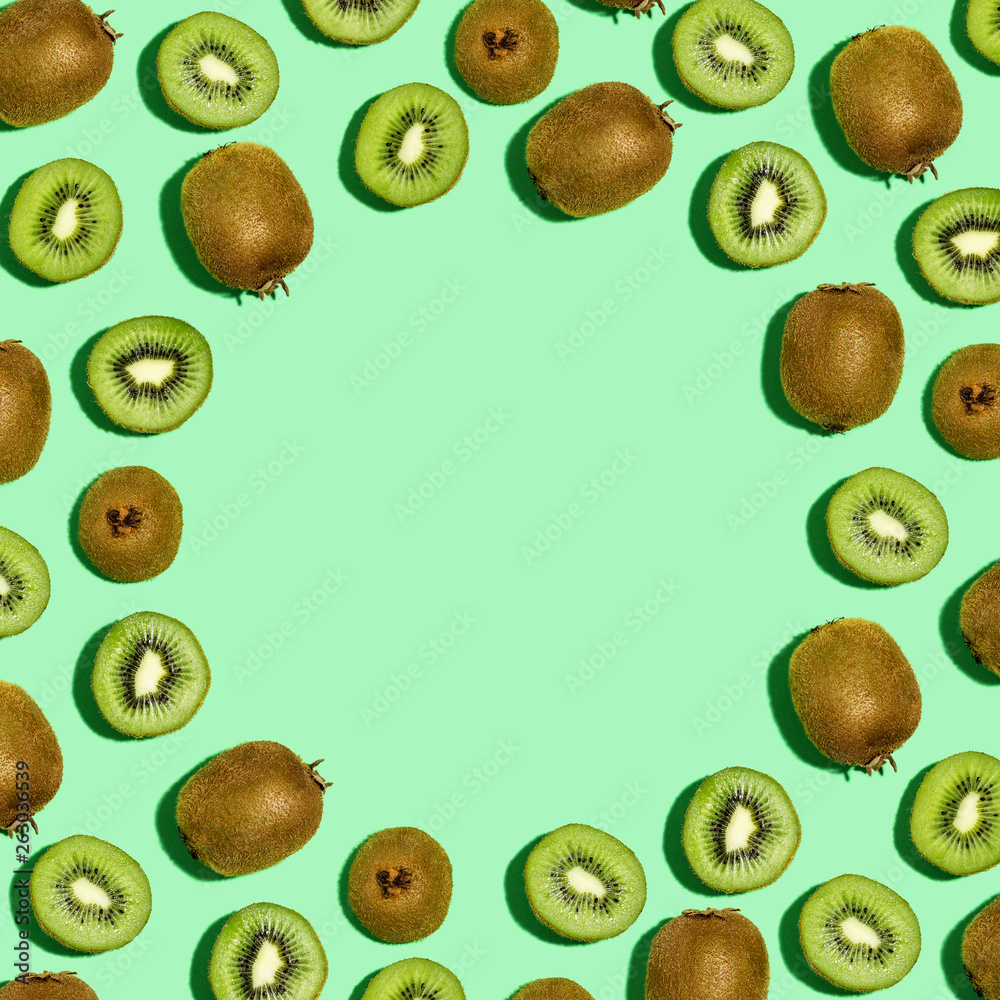 Square frame of kiwi fruits overhead view flat lay