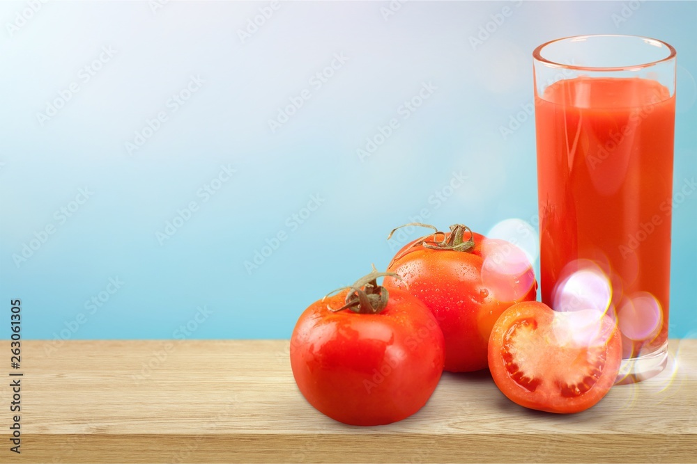 Glass of strawberry smoothie on wooden table