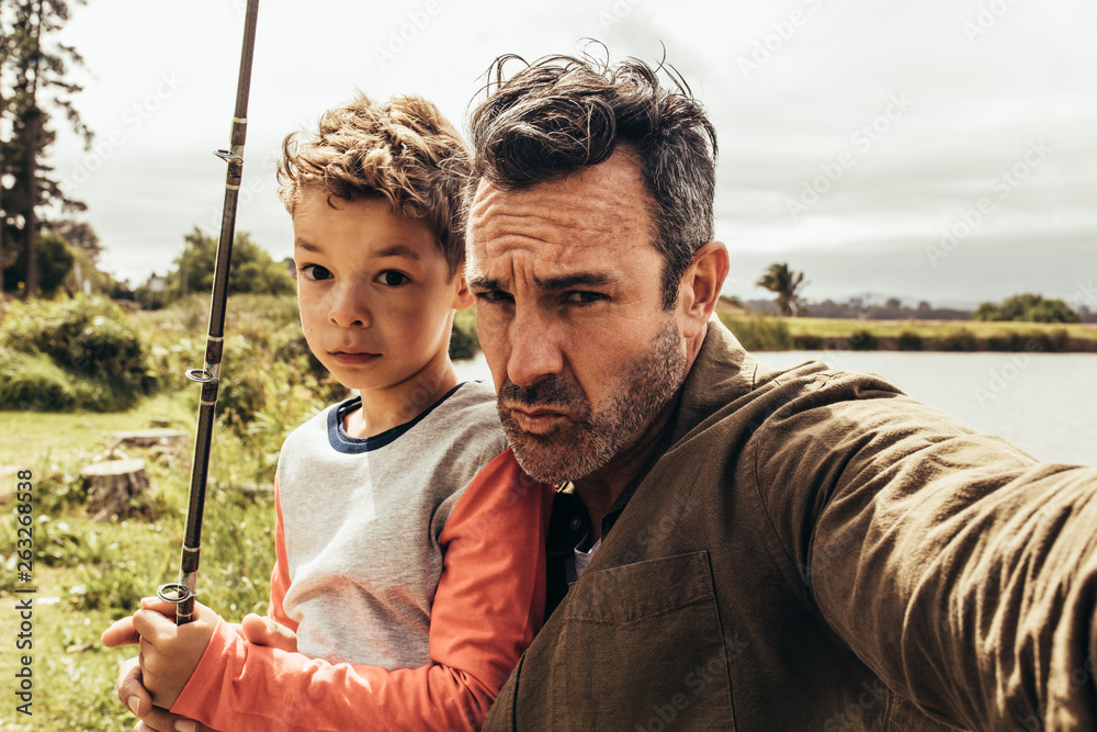 Portrait of father and son out for fishing