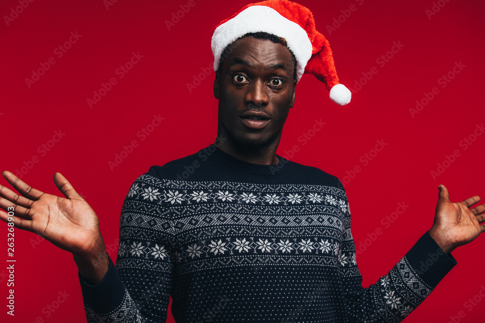 Surprised man with santa hat