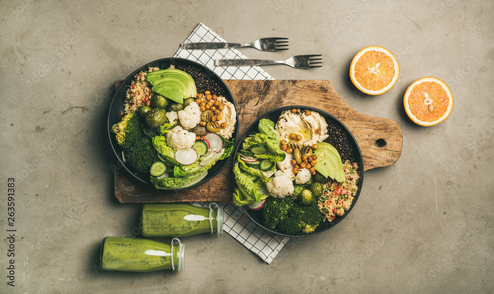 Healthy dinner, lunch setting. Flat-lay of vegan superbowls or Buddha bowls with hummus, vegetables,