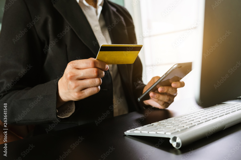 businesswoman hand using smart phone, tablet payments and holding credit card online shopping, omni 